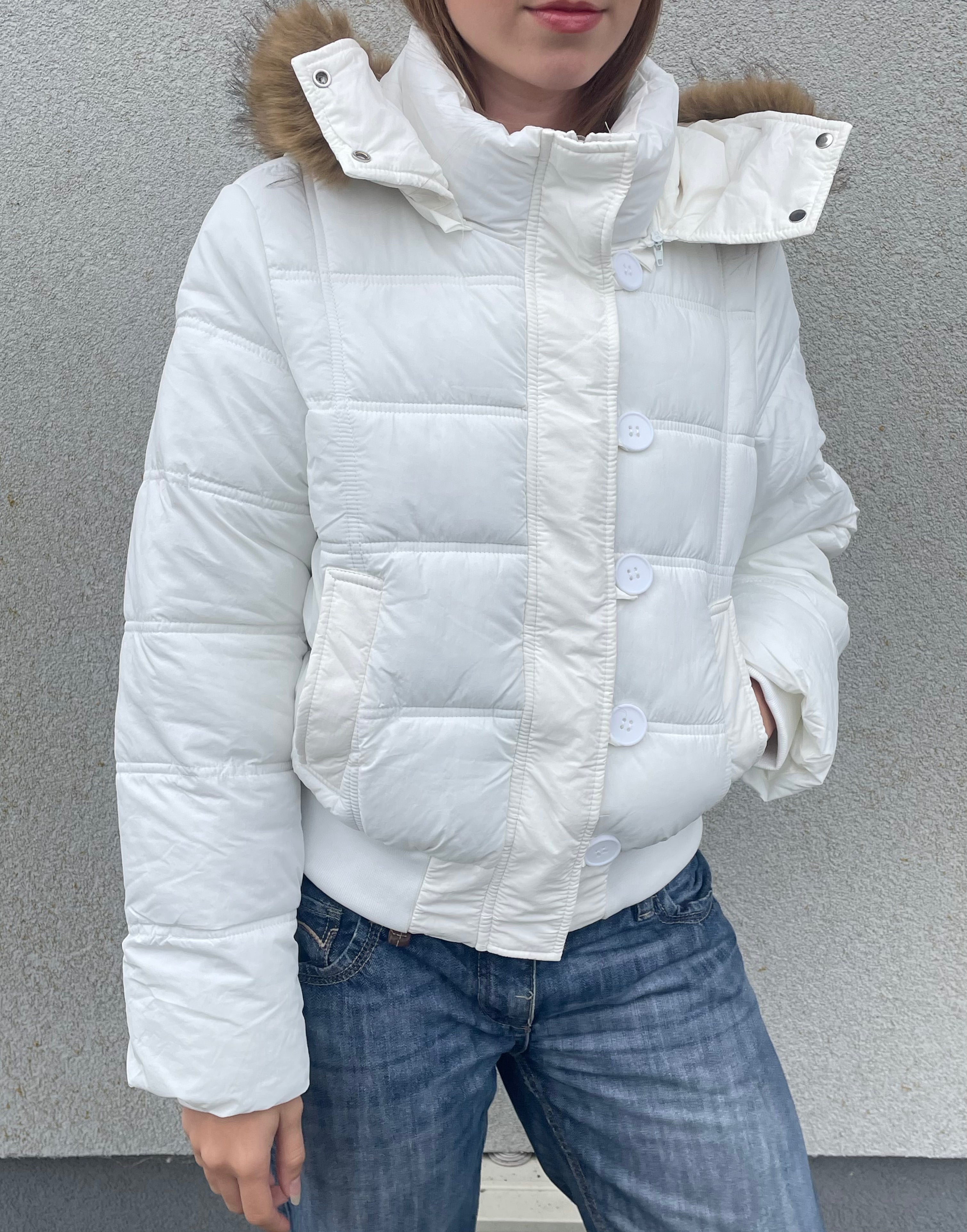 Down winter jacket with a hood trimmed with faux fur